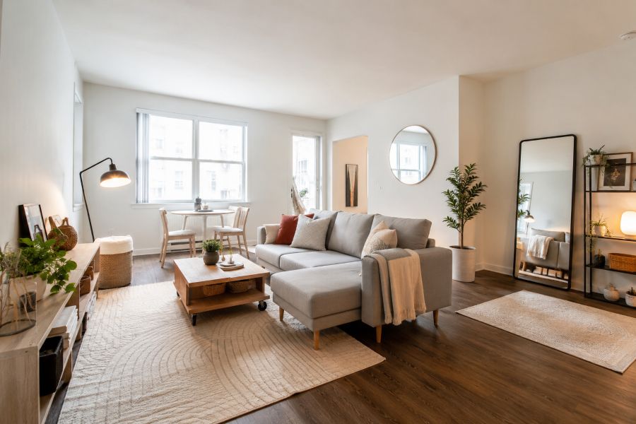 Modular furniture arrangement in small rental apartment with movable coffee table and lightweight seating
